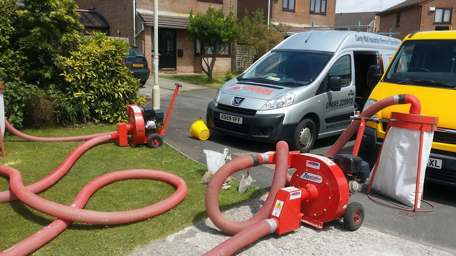 Pro Trade South Wales vans and specialist cavity wall extraction equipment on site